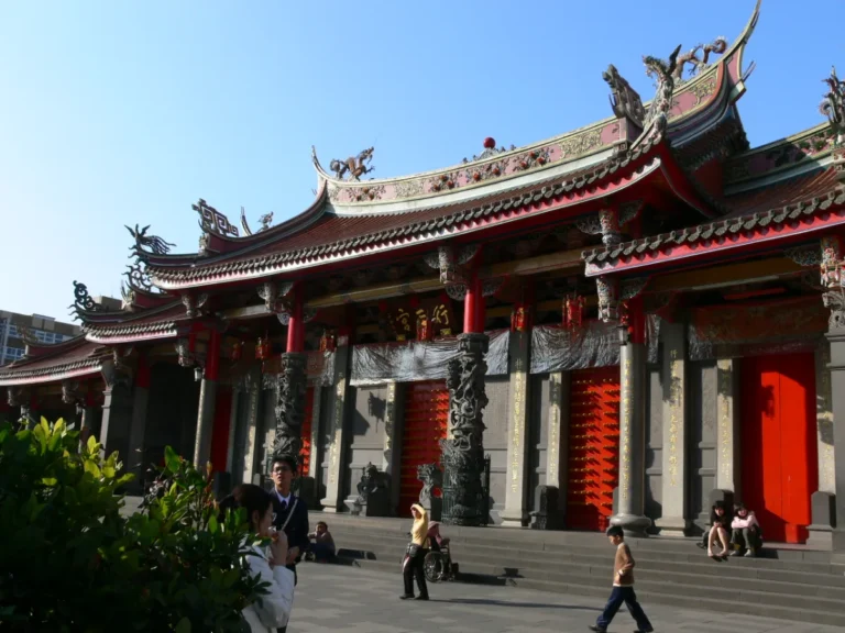 Worshippers at Xingtian Temple, Taipei, which removed its incense censers in 2014